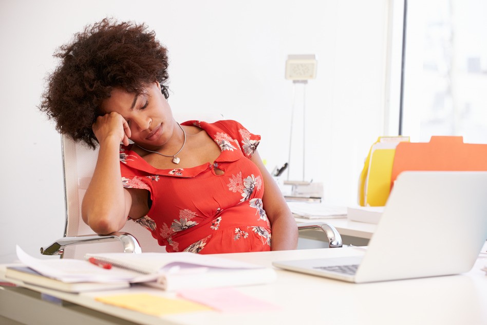 tired woman at desk