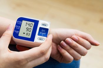 woman measures blood pressure