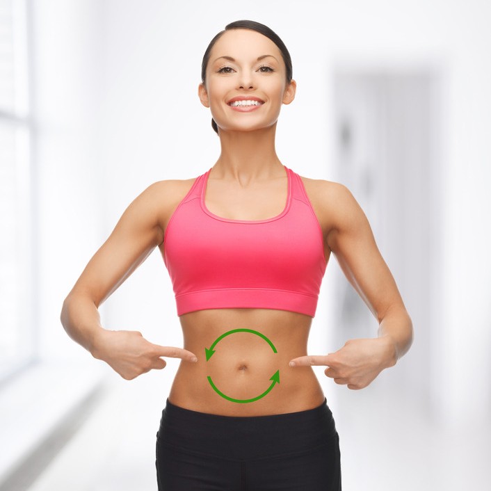 fit woman with arrows making a circle on tummy