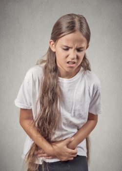 Girl with stomach pain or digestive issues